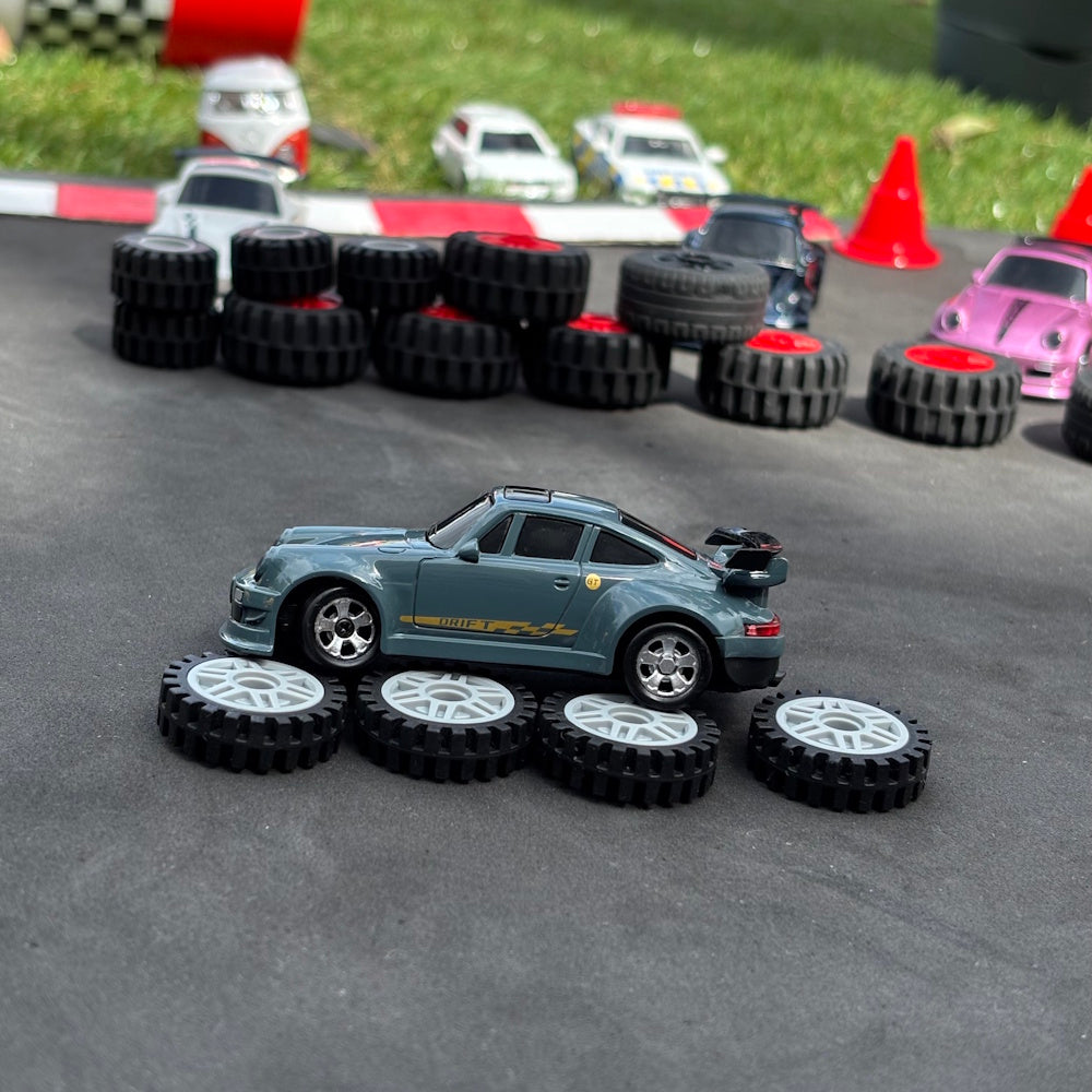 Remote controlled car on a track with tires and cones